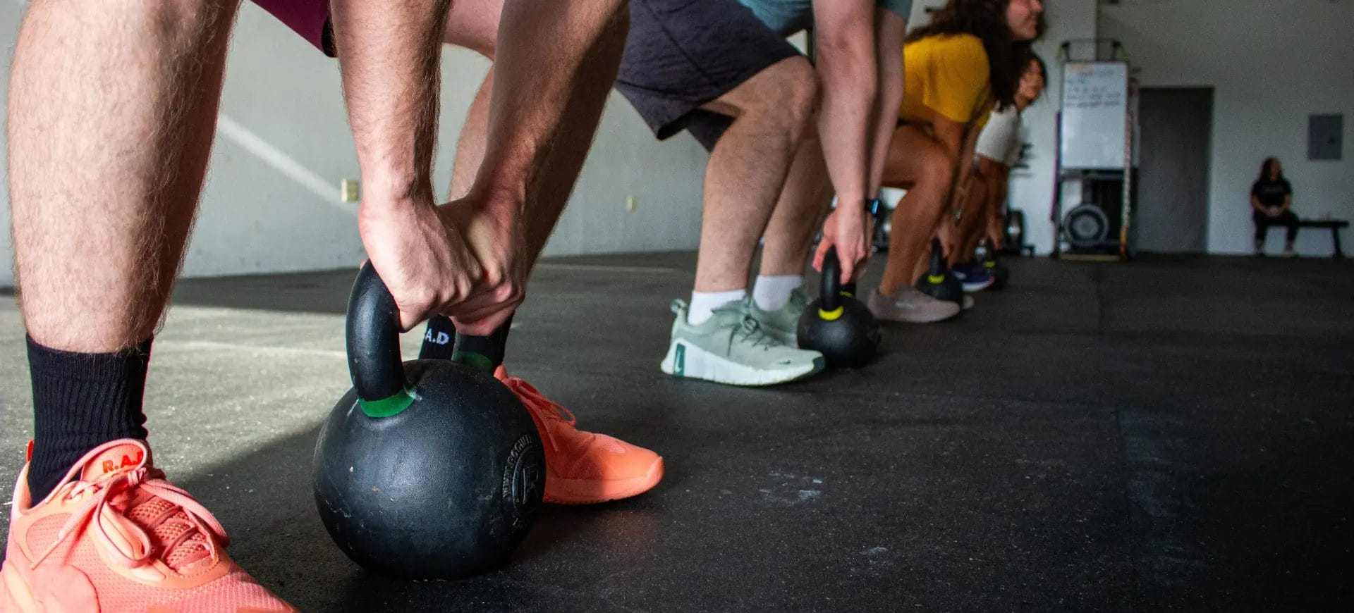 The exercisers are preparing to lift the weights